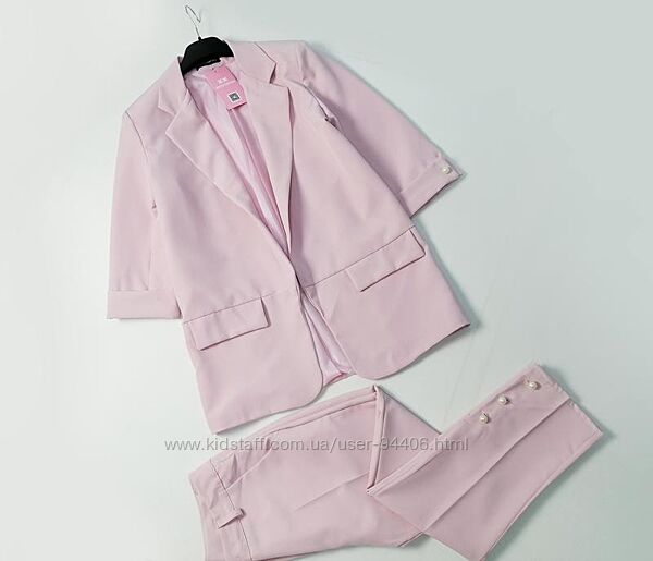 Стильный женский нежно розовый брючный костюм пиджак и брюки