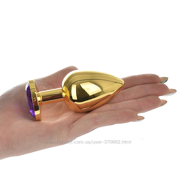 Велика золота анальна пробка з фіолетовим кристалом L від Passion Labs