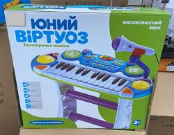 Дитяче піаніно синтезатор на ніжках зі стільчиком 7235 Юний віртуоз два кол